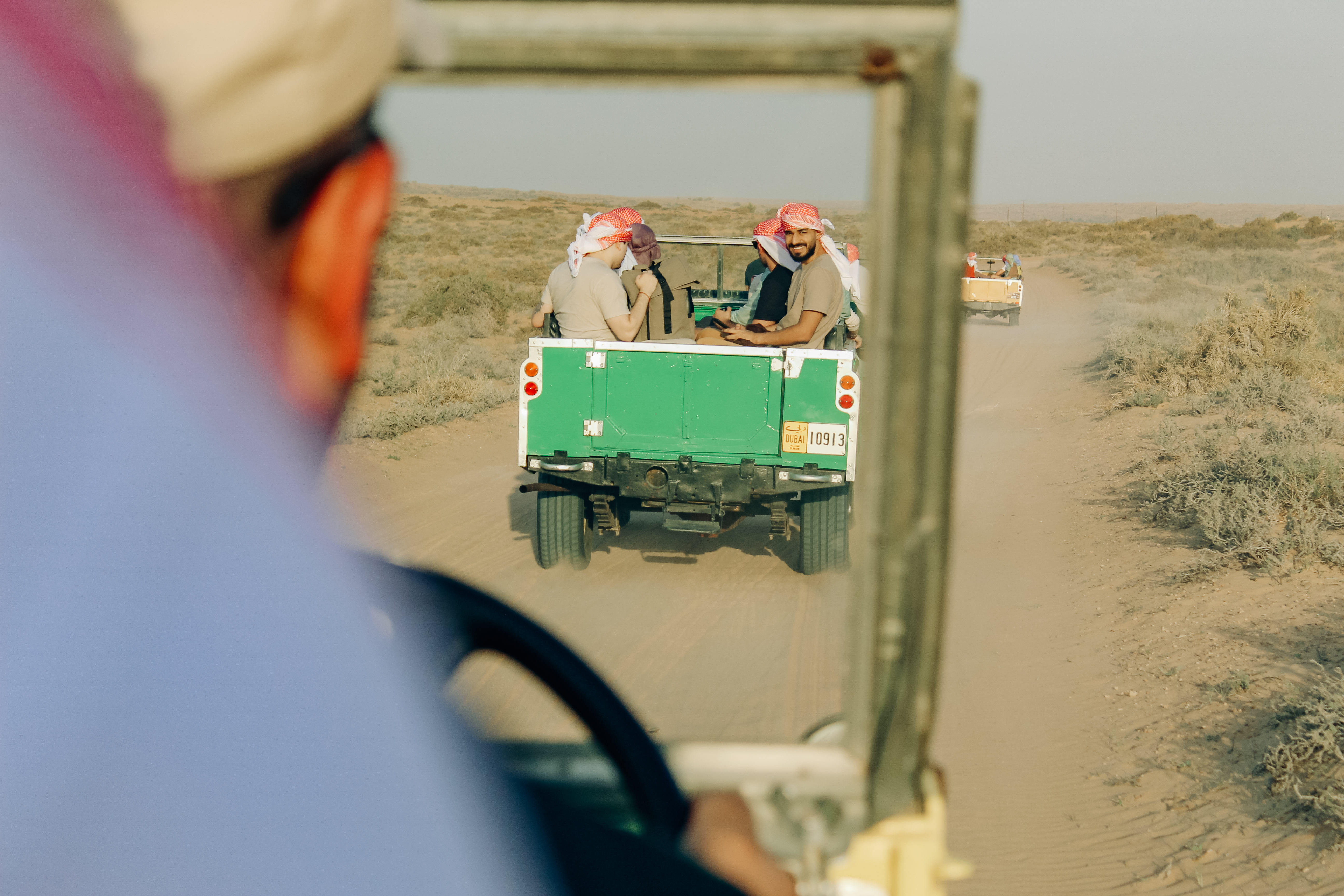 Couple holding hands at sunset in desert